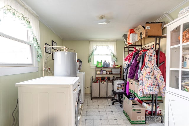 clothes washing area with independent washer and dryer, water heater, crown molding, and a wealth of natural light