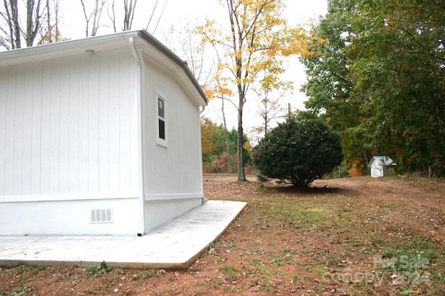 view of side of property featuring a patio