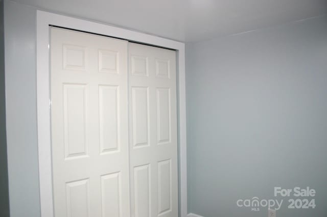 unfurnished bedroom with a closet