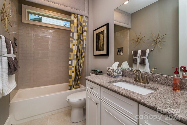 full bathroom with vanity, shower / bath combo, toilet, and tile patterned floors