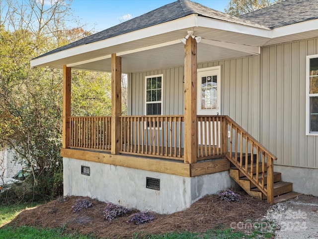 view of exterior entry with a porch