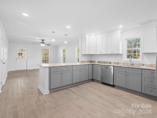 kitchen with stainless steel dishwasher, gray cabinets, white cabinets, and sink