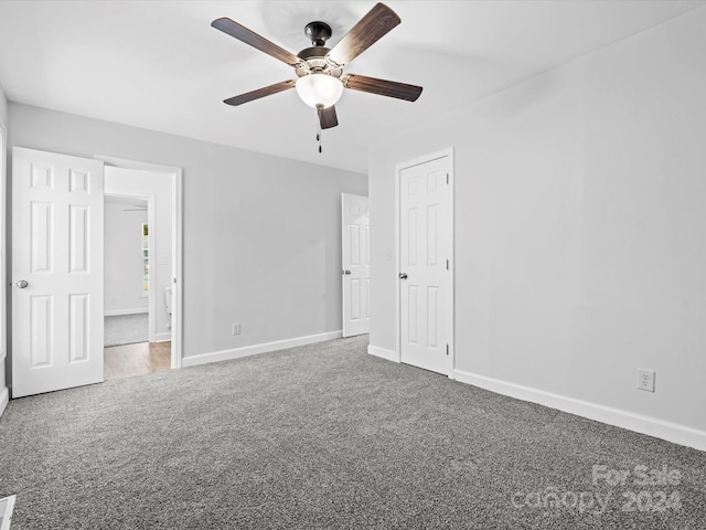 unfurnished bedroom with carpet flooring and ceiling fan