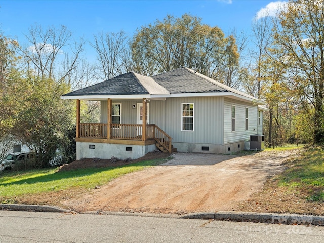 view of front facade featuring central AC unit and a porch