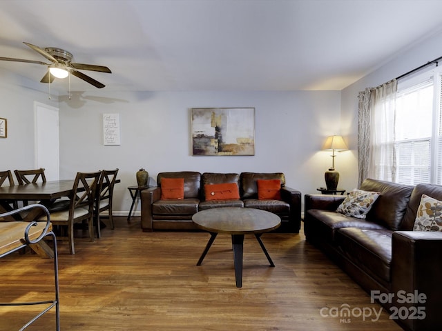 living room with hardwood / wood-style floors and ceiling fan