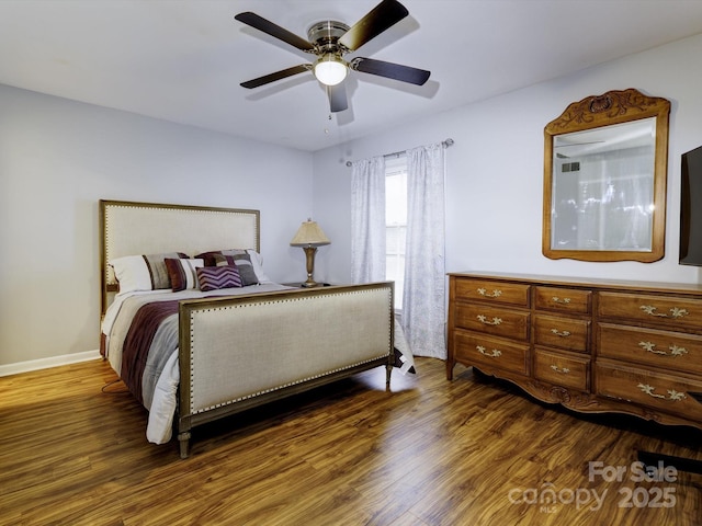 bedroom featuring dark wood-type flooring and ceiling fan