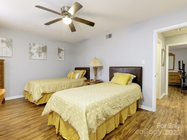 bedroom with wood-type flooring and ceiling fan