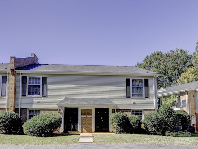 view of front of property with central AC unit