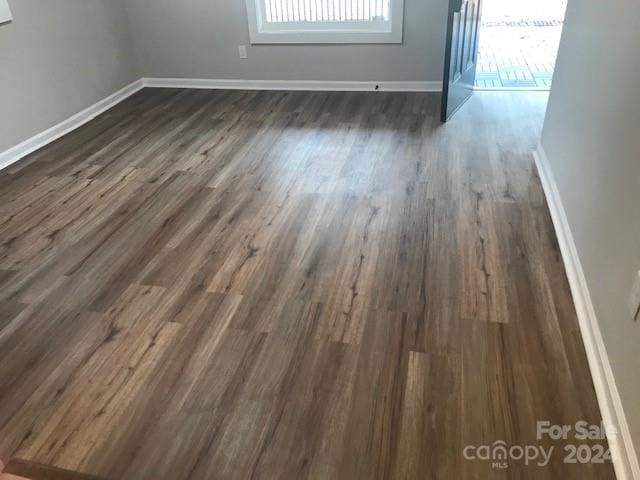 spare room featuring dark hardwood / wood-style floors