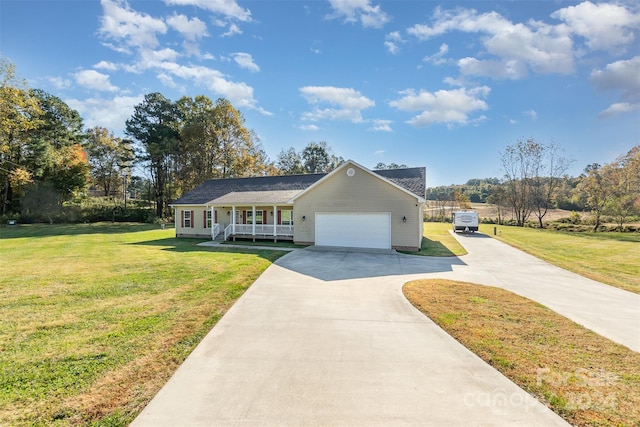 ranch-style home featuring a front yard, covered porch, and a garage