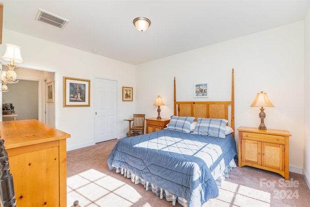 bedroom with light colored carpet