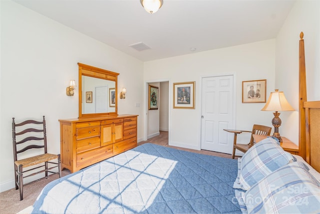 bedroom featuring light colored carpet