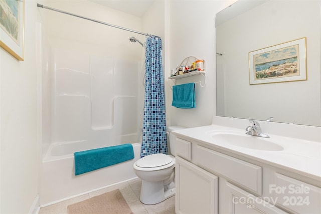 full bathroom with vanity, shower / tub combo with curtain, toilet, and tile patterned flooring