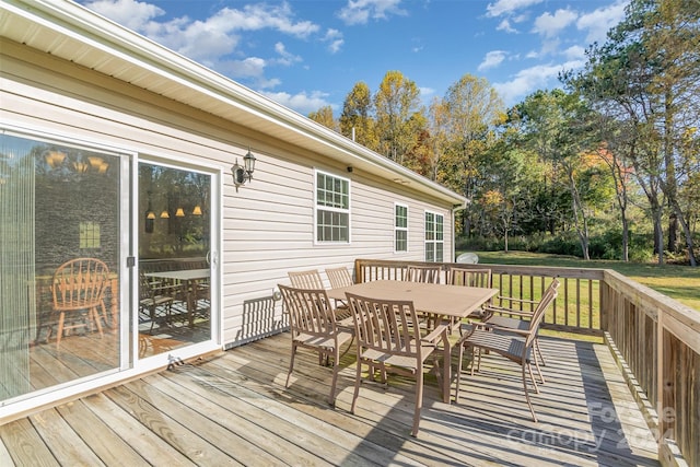 wooden deck featuring a yard