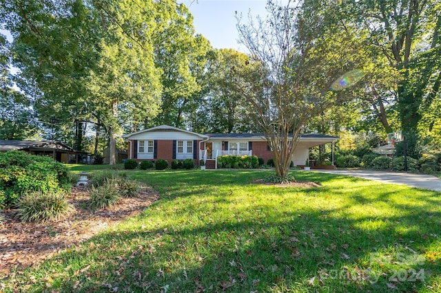 single story home featuring a front yard