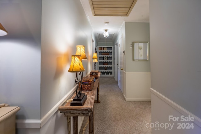 corridor featuring carpet and ornamental molding