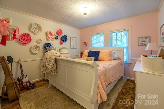 carpeted bedroom featuring a textured ceiling and crown molding