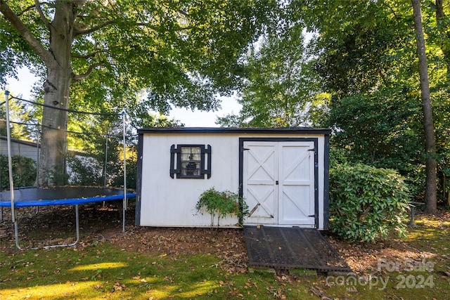 view of outbuilding featuring a trampoline