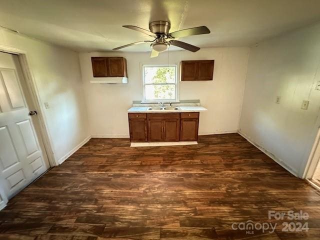 kitchen with dark hardwood / wood-style floors, sink, and ceiling fan