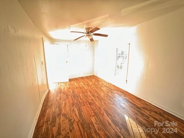 spare room featuring ceiling fan and wood-type flooring