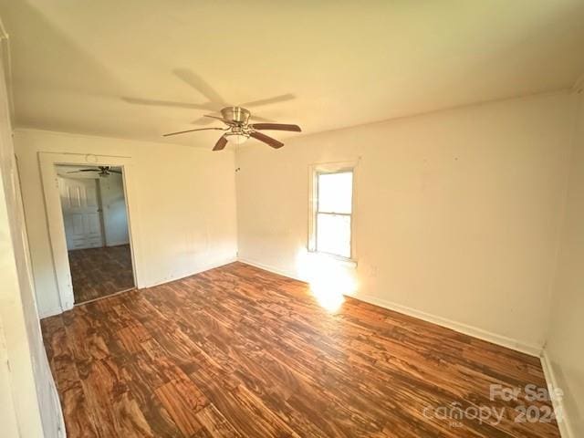 empty room featuring ceiling fan and hardwood / wood-style floors