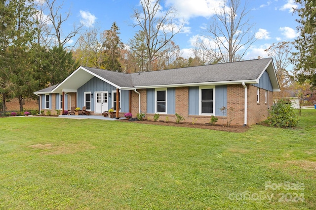 ranch-style house with a front lawn