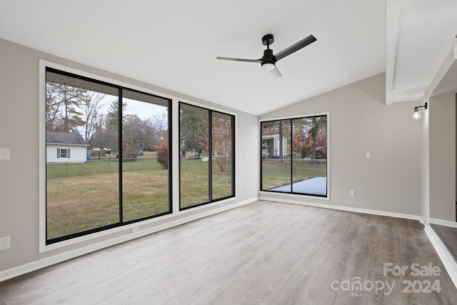 unfurnished sunroom with lofted ceiling and ceiling fan