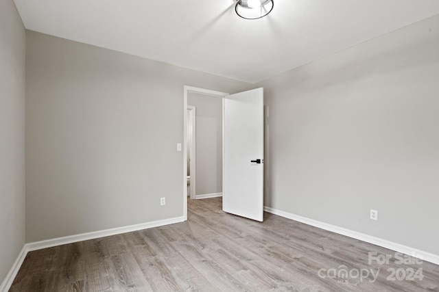 unfurnished room featuring light hardwood / wood-style flooring