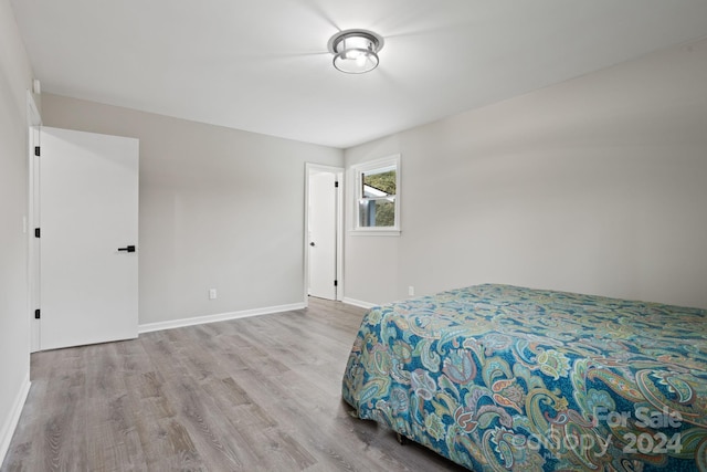 bedroom with light wood-type flooring