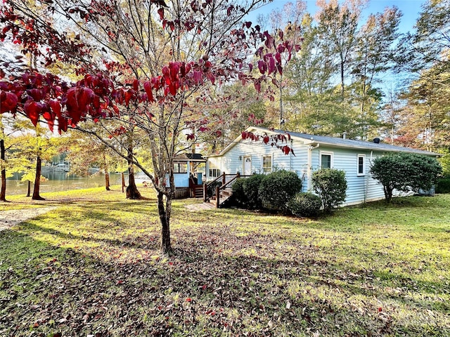 view of home's exterior with a lawn