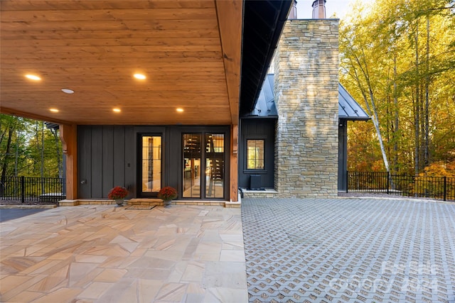 entrance to property featuring a patio