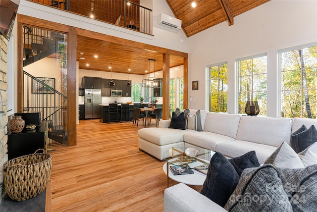 living room with light wood-type flooring, a wall mounted air conditioner, wooden ceiling, beam ceiling, and high vaulted ceiling