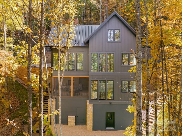 view of home's exterior with a sunroom