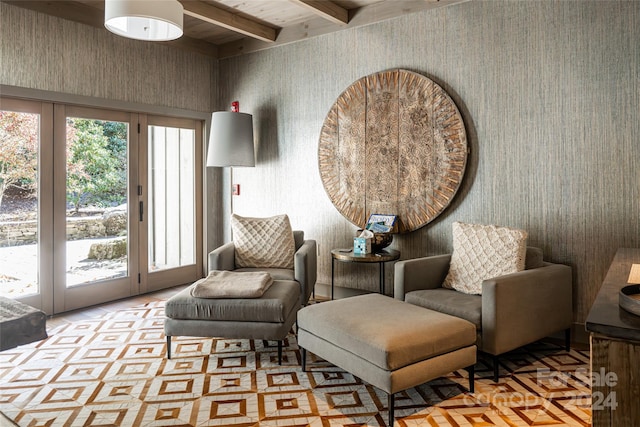 sitting room featuring beam ceiling and wood ceiling