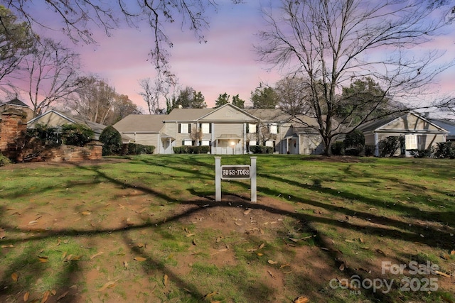 view of front of home featuring a lawn