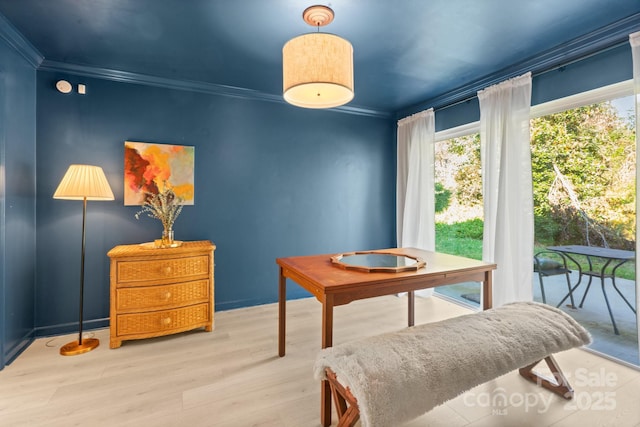 interior space with light hardwood / wood-style flooring and crown molding