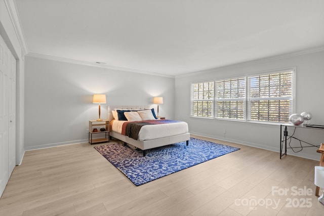 bedroom featuring light hardwood / wood-style floors and ornamental molding