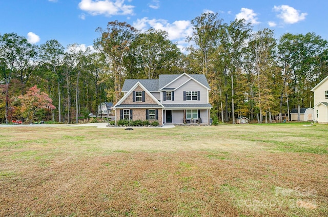 view of front of home featuring a porch and a front lawn