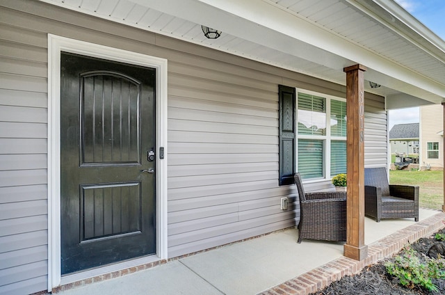 property entrance featuring covered porch