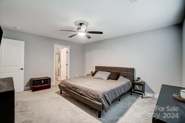 bedroom featuring light carpet and ceiling fan