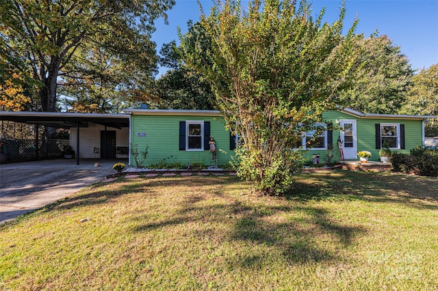 view of front of house with a front yard and a carport