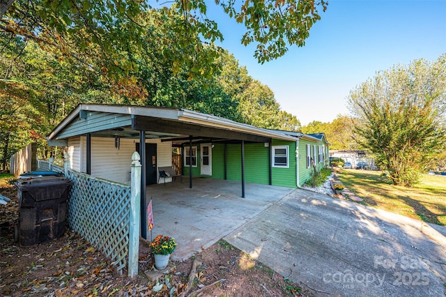 exterior space featuring a carport