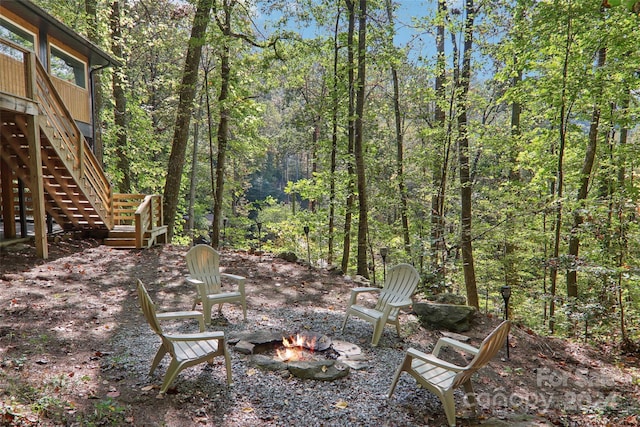 view of yard with an outdoor fire pit