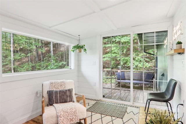 sunroom with beam ceiling