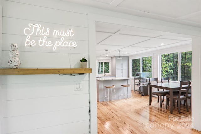 kitchen with hardwood / wood-style floors and a breakfast bar