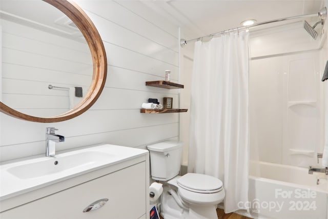 full bathroom with vanity, toilet, shower / bathtub combination with curtain, and wooden walls