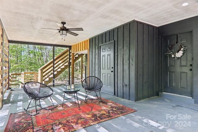 entrance to property with ceiling fan