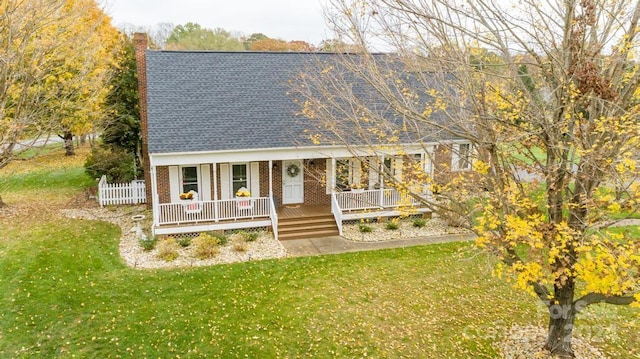 view of front of house featuring a porch and a front yard