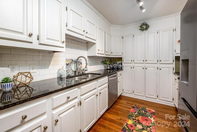 kitchen featuring dishwasher, dark hardwood / wood-style floors, white cabinetry, and sink