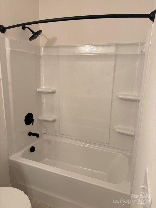 bathroom with toilet and shower / bathtub combination